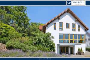 Exklusives Einfamilienhaus mit Einliegerwohnung und mediterranem Gartenambiente
