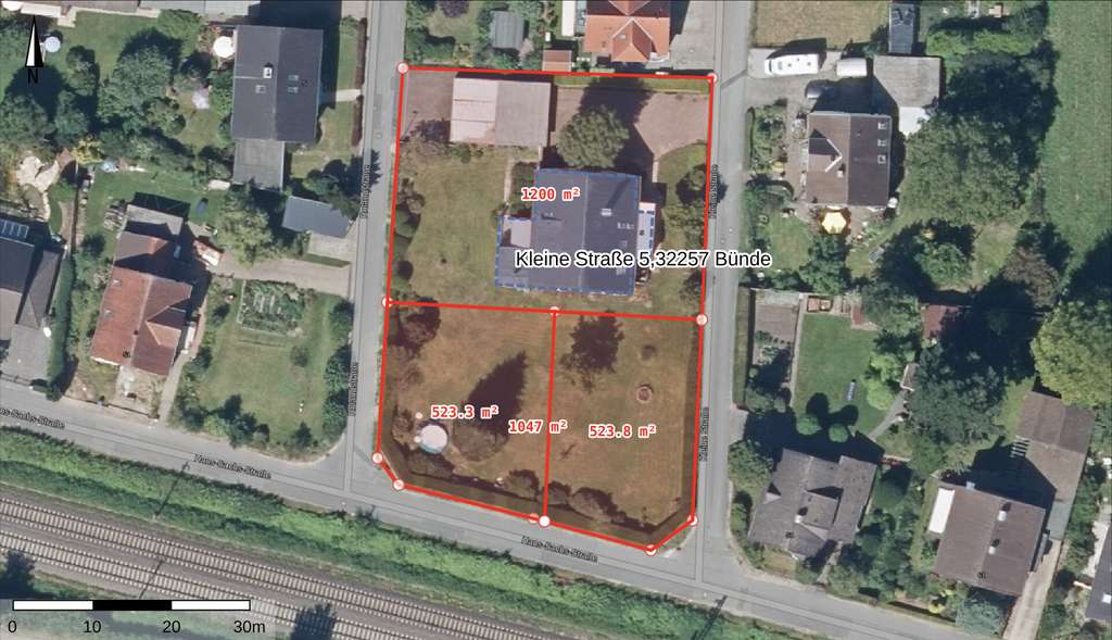 Immobilie in Bünde - Vielseitiges Mehrfamilienhaus mit 3 Wohneinheiten, 5 Garagen & 2 Baugrundstücken in Bünde - Bild 3