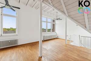 Wohnen mit Weite: Stilvolle Maisonette über den Dächern von Wersten