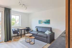 Möblierte 1-Zimmer-Wohnung mit privatem Gartenanteil