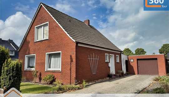 Bild von Einfamilienhaus mit Garage und großzügigem Grundstück