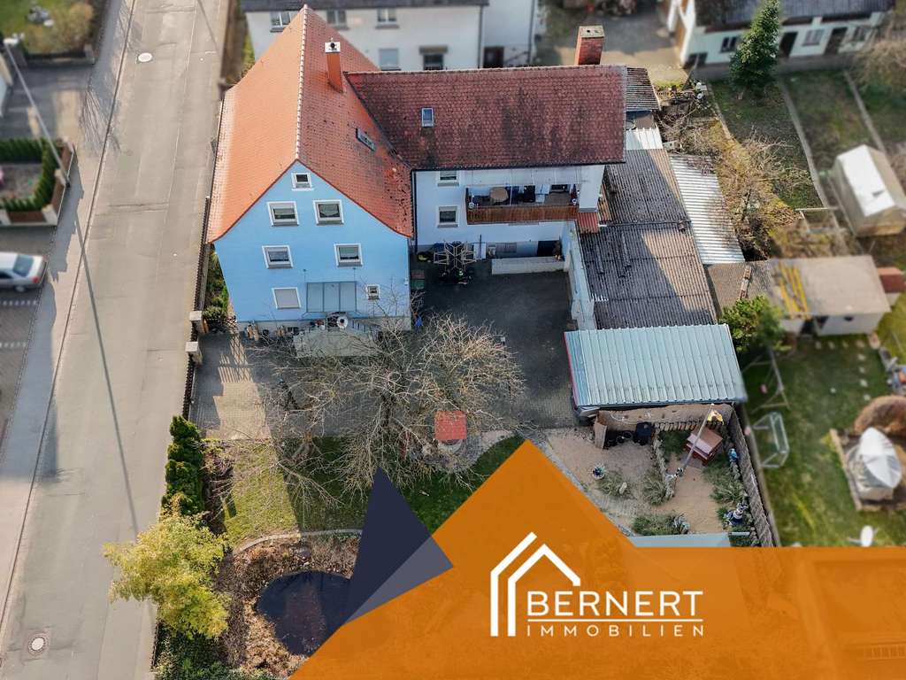 Immobilie in Gundelsheim - Großzügiges Mehrfamilienhaus mit Doppelgarage, Gartenidylle und vielseitigem Nutzungspotenzial - Bild 1