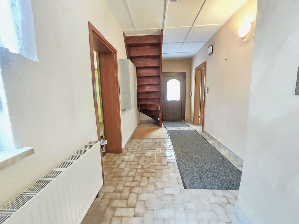 Immobilie in Barby - Charmantes Reihenmittelhaus mit Garage und Garten in ruhiger Lage von Barby - Bild 1