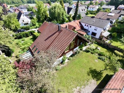 Lichtdurchflutetes Einfamilienhaus mit Wintergarten und idyllischem Gartenparadies
