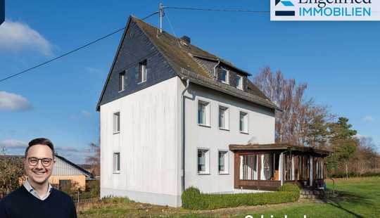 Bild von Geräumiges Einfamilienhaus auf großem Grundstück in ruhiger Ortsrandlage mit Garage