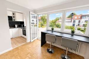 AIGNER - Helle 1-Zimmer-Wohnung mit Balkon in begehrter Bogenhausener Lage