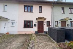 Familienfreundliches Reihenmittelhaus mit großzügigem Wohnkonzept, Garten und Stellplatz