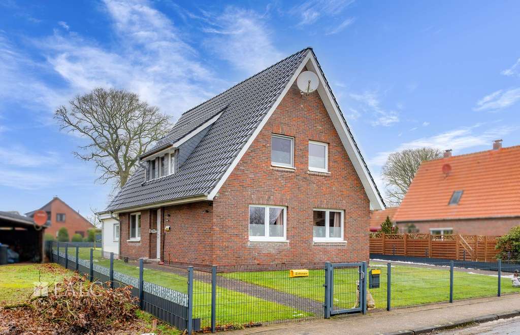 Immobilie in Apen - Charmantes Einfamilienhaus im Zentrum von Apen mit außergewöhnlichem Grundstück - Bild 1