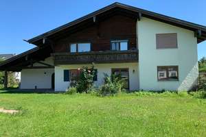 4-Zimmer-Wohnung im EG mit überdachter Terrasse, Gartenanteil und Garage