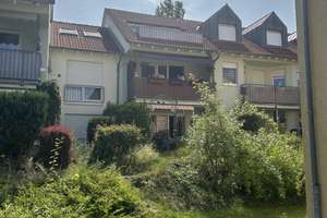 Ruhiges Wohnen mit Blick ins Grüne – 2-Zimmer-Wohnung mit großer Terrasse und Tiefgaragenstellplatz