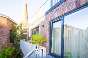 Exklusives Loft-Refugium mit Wow-Faktor in versteckter Hinterhof-Oase