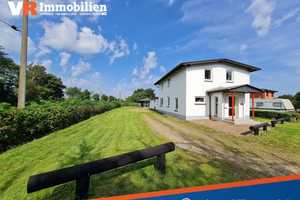 Gepflegtes Einfamilienhaus mit viel Platz, zwei Garagen und einer Gartenlaube – Schleswig-Flensburg (Kreis) – Vorschaubild 1
