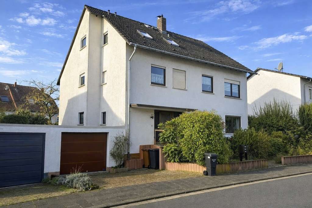 Immobilie in Kriftel - METZ IMMOBILIEN - Mehrfamilienhaus mit freier Erdgeschosswohnung und Garten - Bild 0