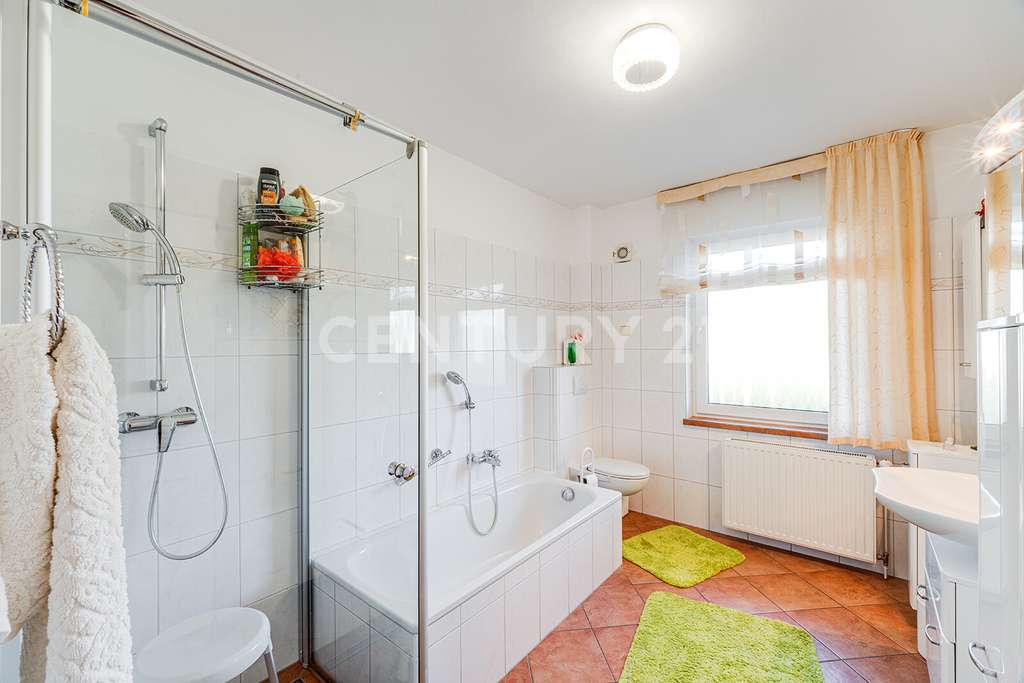 Immobilie in Vollersode - Lichtdurchflutetes Einfamilienhaus in Feldrandlage mit Einliegerwohnung - Bild 3