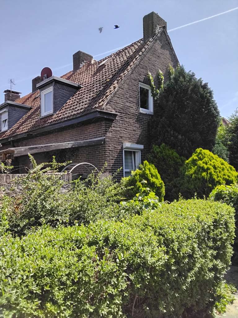 Immobilie in Gronau - Charmantes, vermietetes, teilweise renoviertes und modernisiertes Reihenendhaus mit Garage - Bild 0