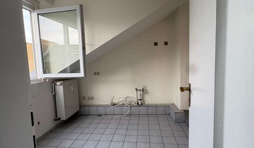 21 m² Dachgeschosswohnung mitten in der City - Foto 2