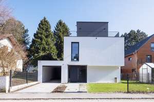 Ein Meisterwerk moderner Architektur - stilvoll, zeitlos und in absoluter ruhiger Traumlage