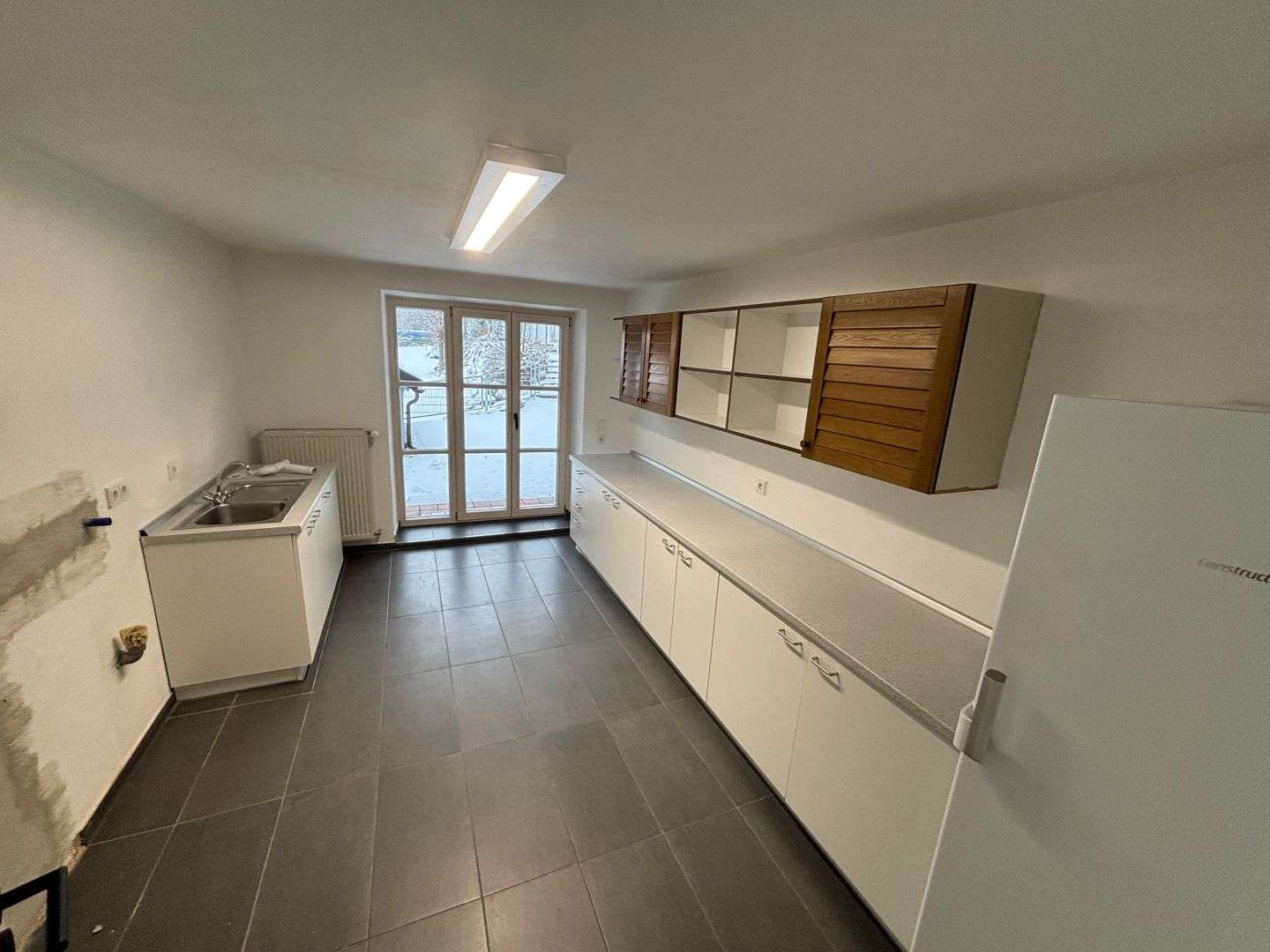 Immobilie in Aschau am Inn - Modernisiertes Mehrparteienhaus mit Büros in Aschau-Werk - Bild 7