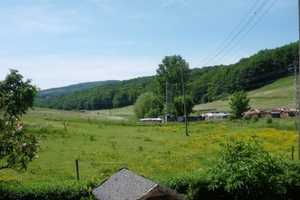 Einfamilienhaus mit 4 Zimmern, EBK, große Holzterrasse und großem Garten in schöner, ruhigen Lage – Kühbörncheshof 8b, 67734 Kaiserslautern (Kreis) – Vorschaubild 6