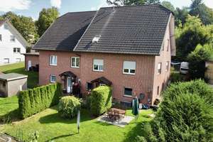 Doppelhaushälfte mit Einliegerwohnung in schöner Wohnlage – Am Hallenbad 8b, 49152 Bad Essen – Vorschaubild 1