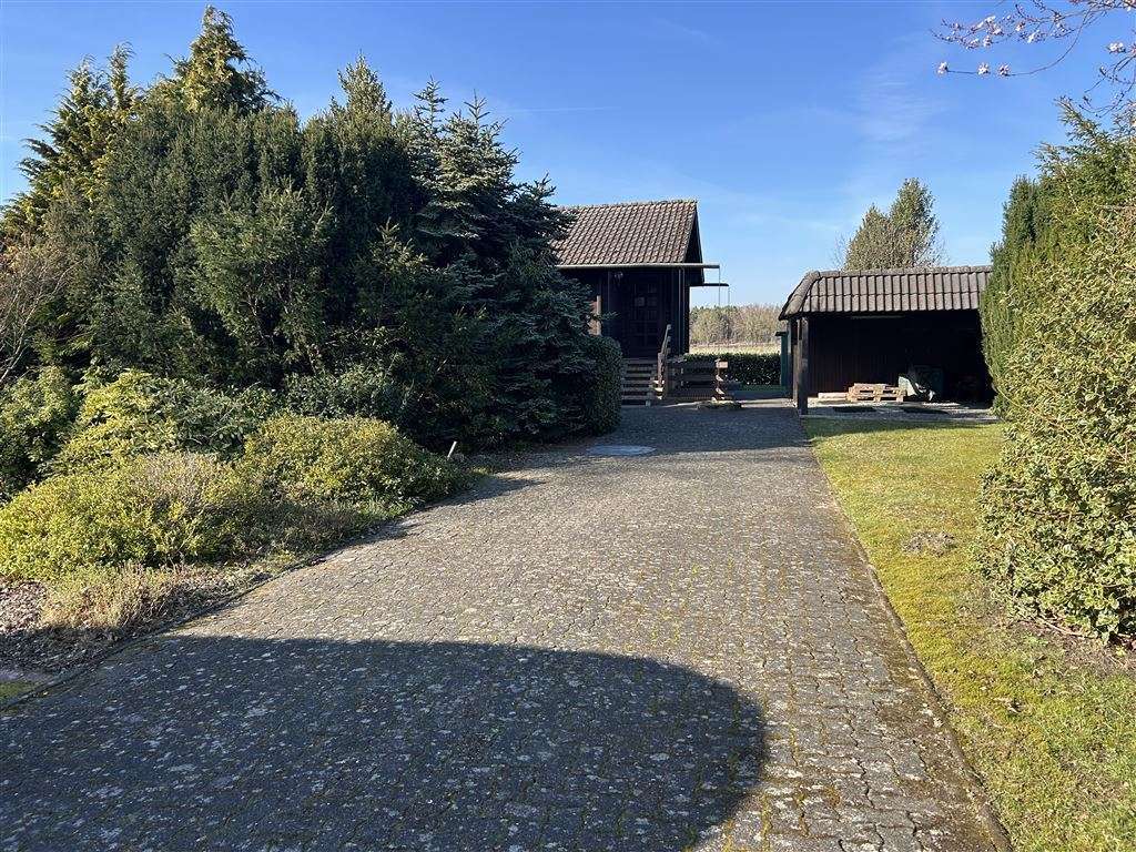 Immobilie in Steyerberg - Charmantes Blockbohlenhaus mit Sonnenterrasse mit tollem Weitblick u. einer beheizbaren Vollkeller. - Bild 2