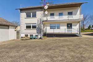 Gepflegtes Wohnhaus mit großen Garagen in ruhiger Lage in Krautscheid – Die vollständige Adresse der Immobilie erhältst du vom Anbieter., 54673 Krautscheid – Vorschaubild 2