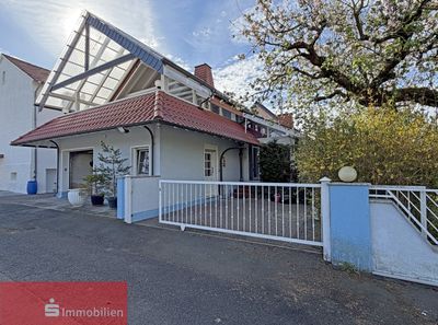 Wohnen mit Charme: Einfamilienhaus mit idyllischem Wintergarten!