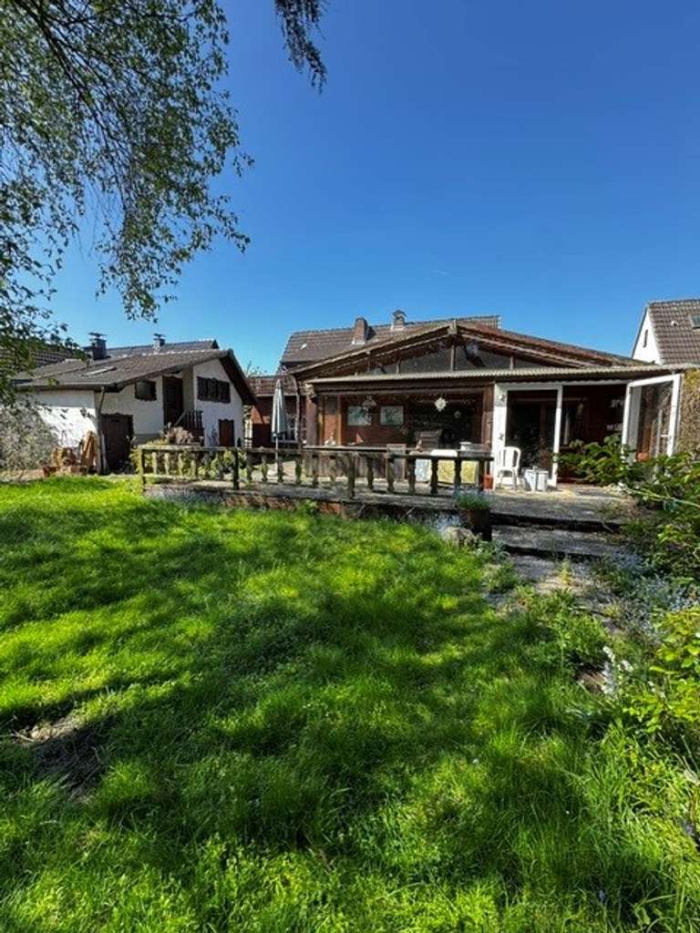 Immobilie in Lünen - Freistehendes Einfamilienhaus mit Einliegerwohnung mit Traumgrundstück in Seenähe - Bild 3