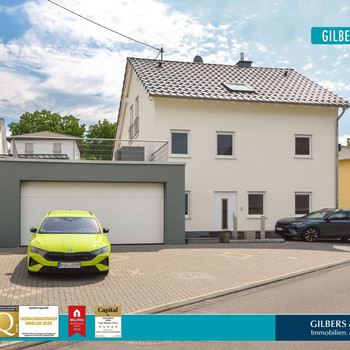 Bekond: Junges Einfamilienhaus, Wärmepumpe, Wintergarten und große Garage mit Platz für mehrere PKW