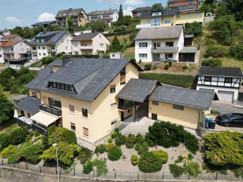 Immobilie in Bad Schwalbach - Gepflegtes Mehrfamilienhaus in Ramschied mit 7 Stellplätzen (Garage) zu verkaufen! - Bild 3