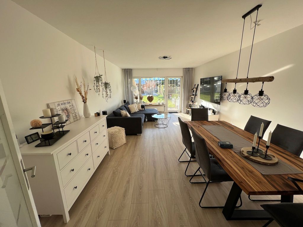 Modernisierte Erdgeschosswohnung mit drei Zimmern sowie Garten und