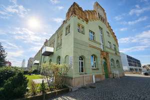 Wohnen im historischen Volksbad – stilvolle 3-Zimmer-Wohnung mit Terrasse und Fernwärme