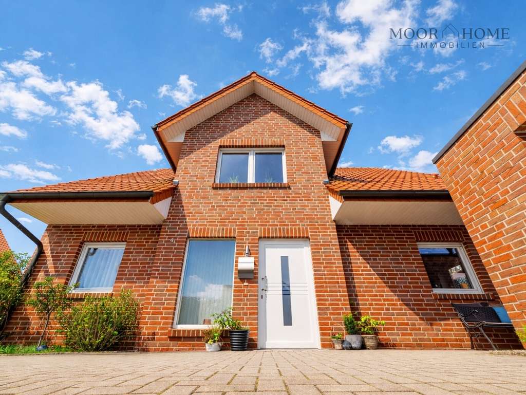 Immobilie in Emsbüren - Einfamilienhaus in Emsbüren mit Kamin, Garage und pflegeleichtem Garten - Bild 1