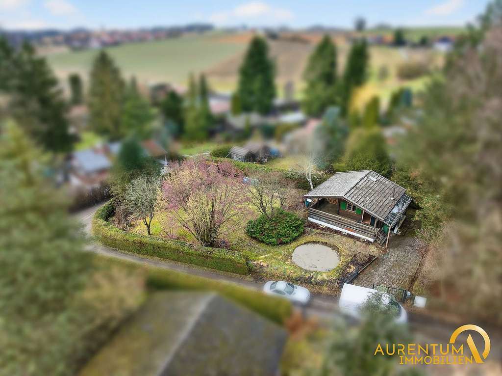 Immobilie in Wurmsham - Charmantes Ferienhaus auf großem Grundstück – inklusive genehmigter Neubauplanung - Bild 0