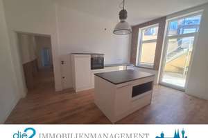 Loft-Wohnung mit Wärmepumpe und Einbauküche in zentraler Lage zu vermieten.