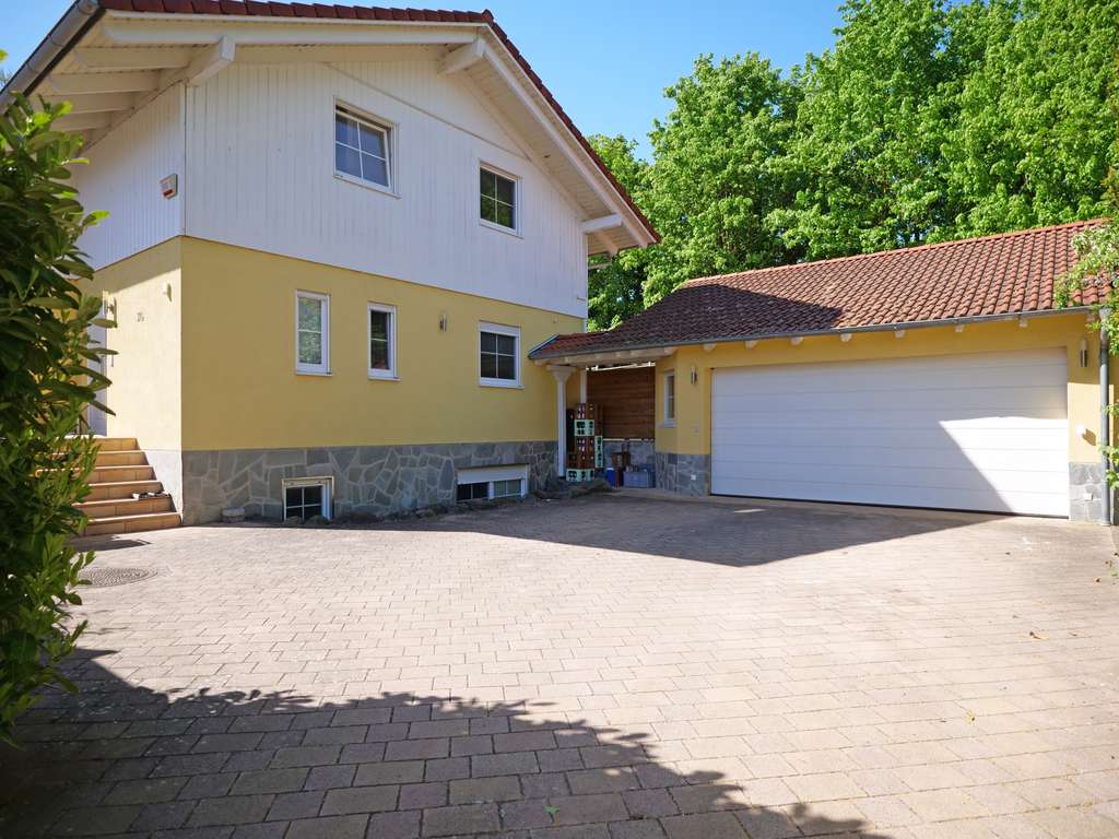 Immobilie in Wörrstadt - Wohnen. Wellness. Werkstatt. — Dieses Haus kann alles. - Bild 1