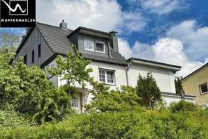 Wohnen mit Ausblick – Einfamilienhaus mit Einliegerwohnung und besonderem Charakter