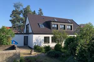 Außergewöhnliche Wohnungen in Architektenhaus mit viel Platz und Grün