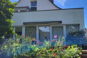 Besonderes Einfamilienhaus mit einer vermieteten Einliegerwohnung im OG!