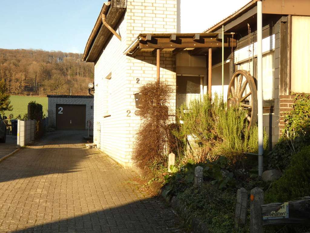 Immobilie in Dissen - Solides Wohnhaus mit Garage und Gartenanteil in ruhiger Siedlungslage von Dissen aTW - Bild 4