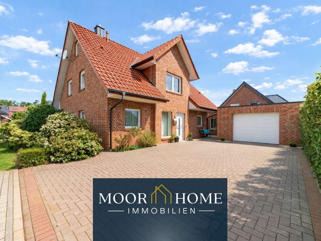 Immobilie in Emsbüren - Einfamilienhaus in Emsbüren mit Kamin, Garage und pflegeleichtem Garten - Bild 0