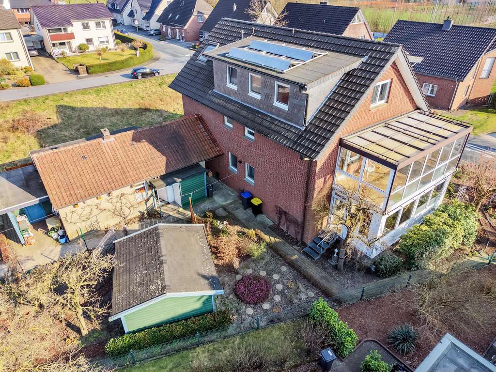 Immobilie in Verl - Charmante 3-Zimmer Erdgeschosswohnung mit eigenem Garten, Wintergarten, Terrasse und Garage - Bild 1