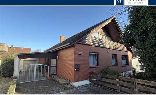 Wollmesheimer Höhe - Ruhig gelegenes Einfamilienhaus mit Klinkerfassade, kleinem Garten und Garage