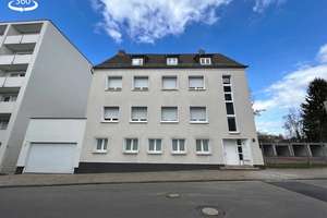 Modernisiertes Mehrfamilienhaus mit drei Wohneinheiten, Terrasse, Balkon & 5 Garagen