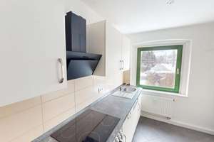 Erdgeschosswohnung mit Einbauküche in ruhiger Wohnlage