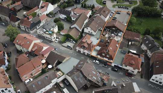Bild von Geschäftshaus mit Ladenfläche in etablierter Einkaufslage und großzügigen Wohnungen in Wehrheim-City