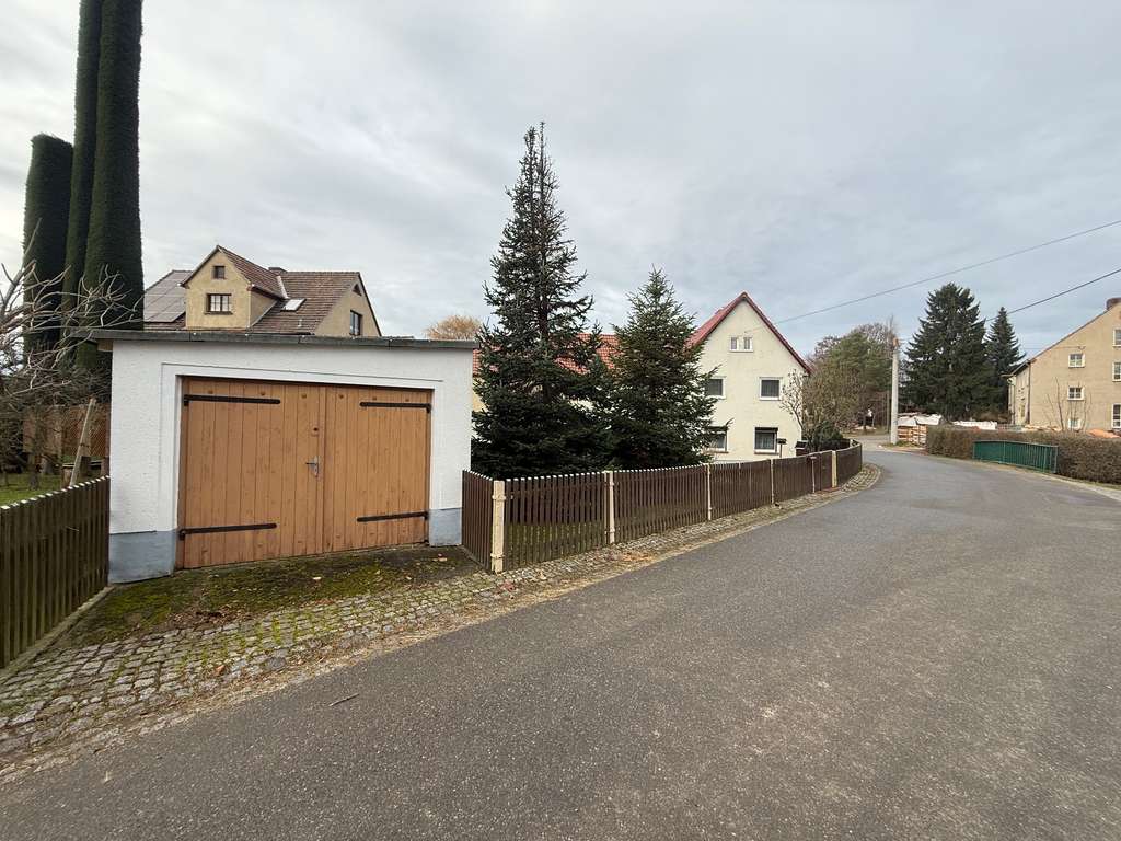 Immobilie in Frohburg - Einfamilienhaus mit Garten und Garage zu verkaufen. - Bild 1