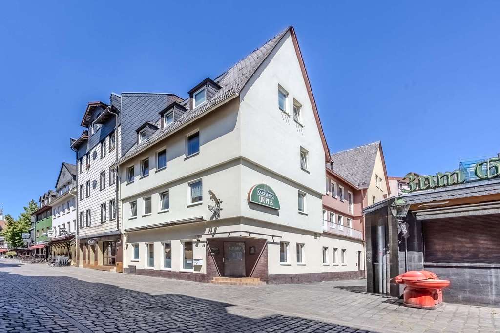Langfristige Investitionschance in Sachsenhausen! Wohn- und Geschäftshaus in zentraler Lage
