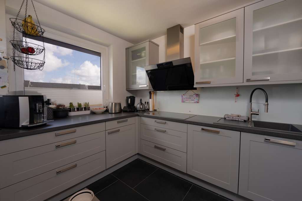 Immobilie in Appen - Sanierte 3-Zimmer-Eigentumswohnung mit Loggia, Garage und Stellplatz in ruhiger Lage in Appen - Bild 1