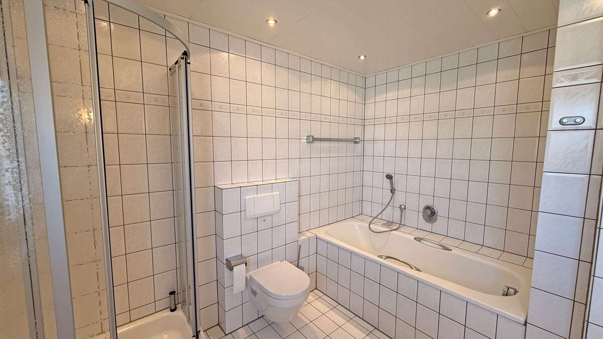 Immobilie in Dinslaken - Großzügige Maisonette-Eigentumswohnung mit Garage auf einem Erbpachtgrundstück in Dinslakener Bruch - Bild 6